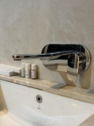 a faucet on a sink in a bathroom at Rudreshwar Mahadeo Kothi in Varanasi