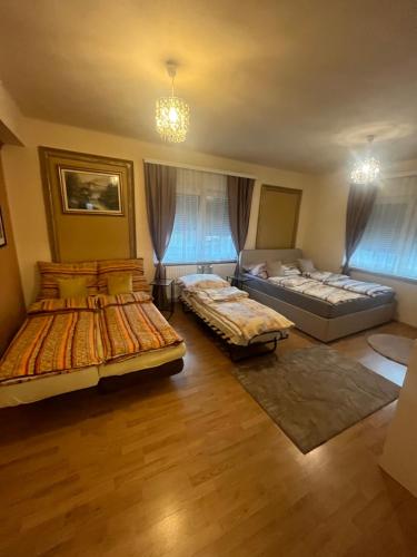 a large room with two beds and a couch at Wohnung Sonja in Villach