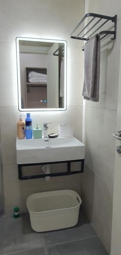 a bathroom with a white sink and a mirror at RADIO HOTEL Lushnje in Lushnjë