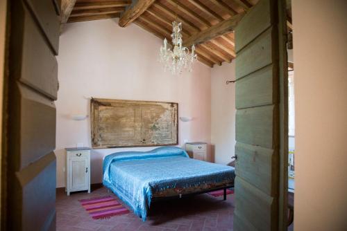En eller flere senge i et værelse på Agriturismo L'isola