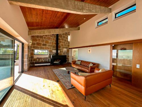 a living room with a couch and a fireplace at Quinta Vale da Roca in Sintra