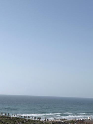 a view of the ocean from a beach at Bat Yam apartment in Bat Yam