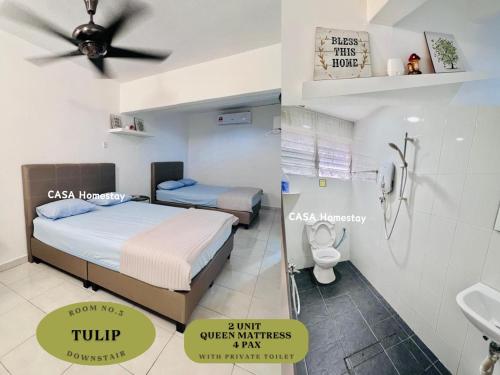 a bedroom with a bed and a sink and a toilet at CASA Homestay in Batu Pahat