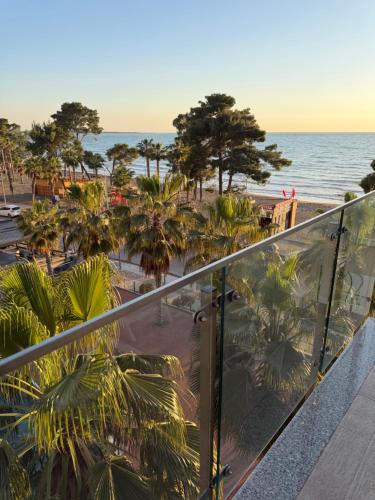 a view of the beach from the balcony of a resort at Apartment Gerti - Sea view in Shëngjin