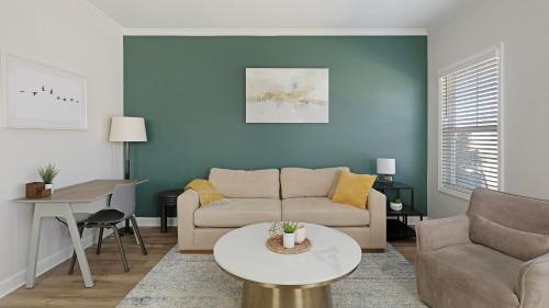 a living room with a couch and a table at Landing Beautiful 1BD Clubhouse Pool in Owens Cross Roads