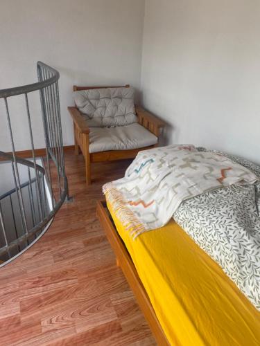 a room with a bed and a couch in it at Wachtgasse in Adliswil