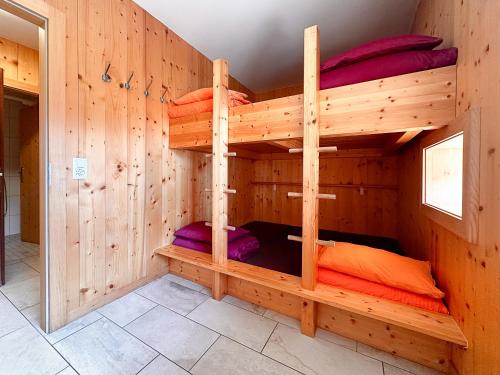 a bunk bed room with two bunk beds in it at Gîte de chandonne in Liddes