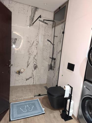 a bathroom with a shower with a toilet in it at Imperial Rabat - MAKE IT YOURS in Rabat