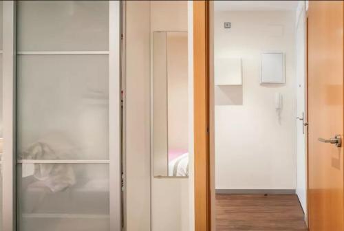 a sliding glass door leading to a bedroom at Tendency Plaza España in Barcelona