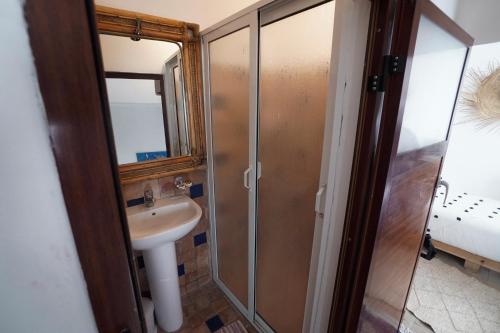 a bathroom with a sink and a shower at CASA ADiL in Tangier
