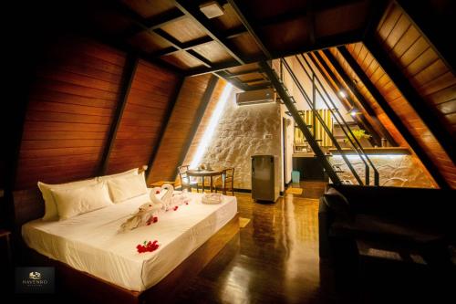 a bedroom with a large bed in a room at HAVENRO Weligama in Weligama