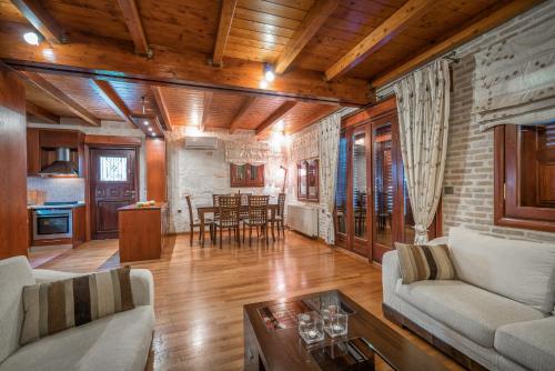 a living room with a couch and a table at Melissa Stone House in Alykes