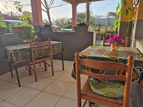 a table with two chairs and a table with a table cloth at Cote de France in Fundura