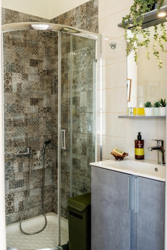 a bathroom with a shower and a sink at Vrachos Nature Lodges DAPHNE 2, Private pool in Agia Galini