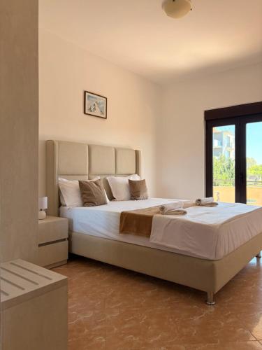 a bedroom with a large bed in a room at Antonios Apartments in Ulcinj