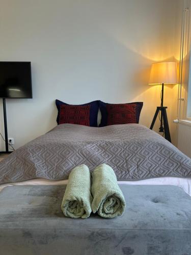 a bedroom with a bed with two towels on it at Appartment in Espoo in Helsinki