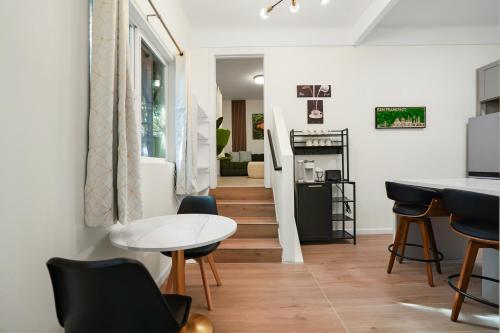 a living room with a table and chairs at Cozy Affordable Private Rooms Newly Renovated near SF Transportation in San Francisco