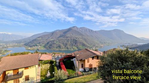 a view of a valley with a river and mountains at La Magia del Lago in Ranzanico