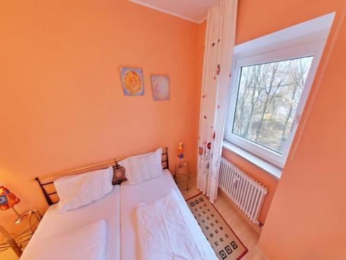 a bedroom with a bed and a window at Appartement Sandra im Bayerischen Wald mit Pool in Freyung