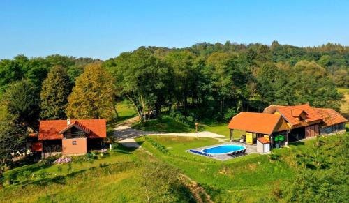 an aerial view of a house with a swimming pool at Holiday Home BIBA With Heated Outdoor Pool in Gornja Stubica