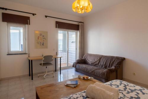Large room with private lounge area, work space and balcony