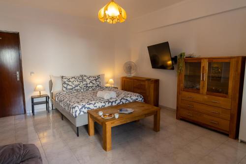 Large room with private lounge area, work space and balcony