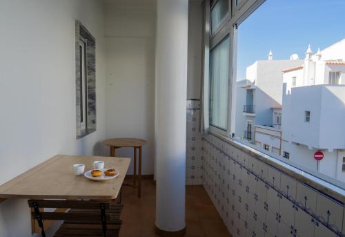 Large room with private lounge area, work space and balcony
