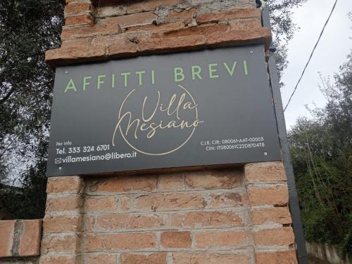 a sign for a wildlife museum on a brick wall at Villa Mesiano in Polistena