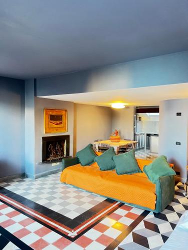a bedroom with a large bed and a table at La Masia in Portovenere