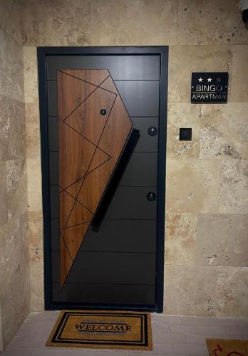 a black door with a geometric design on it at Studio-Apartman Bingo in Pančevo