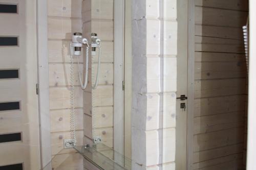 a shower in a room with a glass door at Villa Kaiser in Lviv