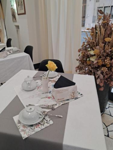 a table with a box on top of it at Hotel Gentile in Noli