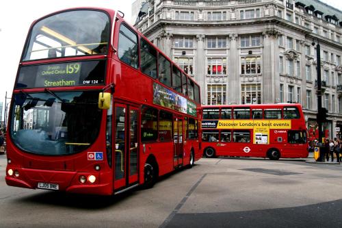 two red double decker buses on a city street at London Backpackers Youth Hostel 18 - 35 Years Old Only in London