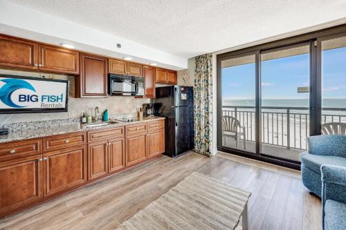 a kitchen with a view of the ocean at Beautifully Decorated Condo with Amzing Ocean View in Myrtle Beach