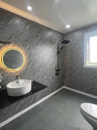 a bathroom with a sink and a mirror at Khế Homestay Phố Cổ Ninh Bình in Ninh Binh