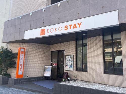 a kokomo sign on the side of a building at KOKO STAY Shonan Fujisawa - formerly Hotel Wing International Shonan Fujisawa in Fujisawa