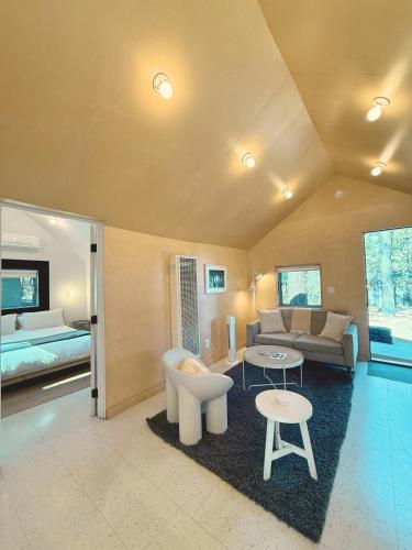 a large living room with a couch and a bed at Colorado Lodge in Big Bear Lake