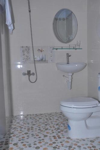 a bathroom with a toilet and a sink at Phuc Hau Hotel - Ly Son in Ly Son