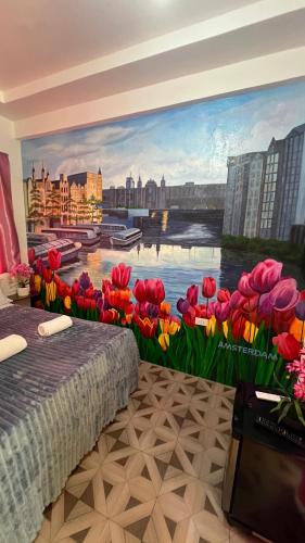 a mural of a river with red and yellow flowers at Dutch Guest House Studio in Siquijor