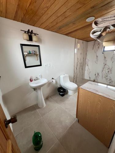 a bathroom with a sink and a toilet at Cabaña con Piscina para Descansar in Chihuahua