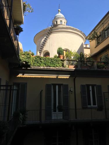 a building with a dome on top of it at Le Petit Hotel in Turin