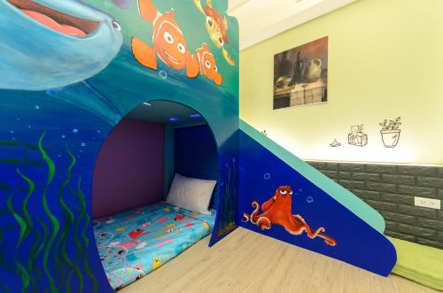 a childrens room with a bed in a cave at Happy House Homestay in Hualien City