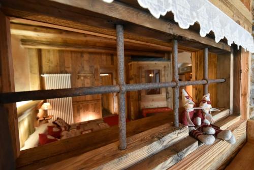a model of a window in a wooden room at L'Ancien Paquier Chambre D'Hotes in Valtournenche