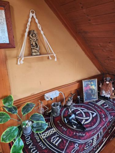 a room with a table with a plant on it at 버킷 제주 - Bucket Jeju in Seogwipo