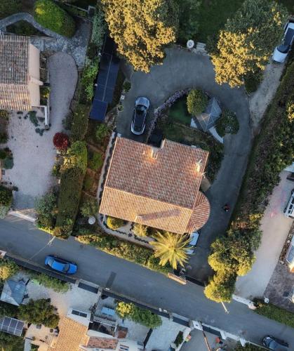an overhead view of a street with cars in a parking lot at Rez de Villa Pébrier in Fréjus