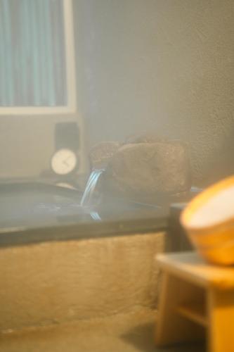 a blurry picture of a bed in a room at RoheN HAKONEYUMOTO in Hakone