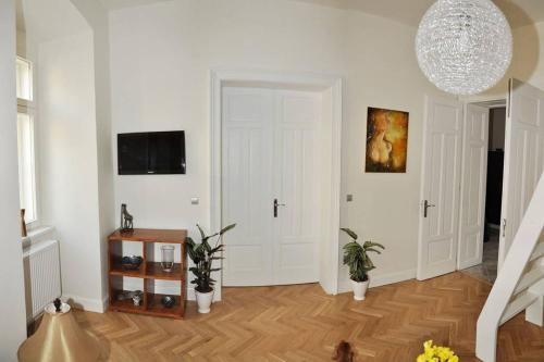 
a living room filled with furniture and a door at Luxury Apartment Novobranska in Brno
