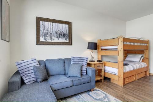a living room with a couch and a bunk bed at Majestic Views - Steps to the Trails in Fraser