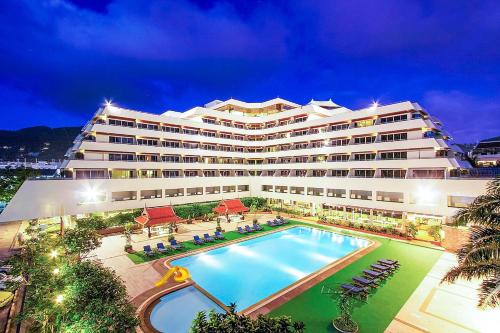 a large hotel with a swimming pool in front of it at Patong Resort Hotel - SHA Extra Plus in Patong Beach