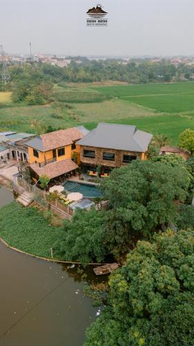 an aerial view of a house with a swimming pool at Trang An Ninh Binh Rustic Hideaway in Ninh Binh